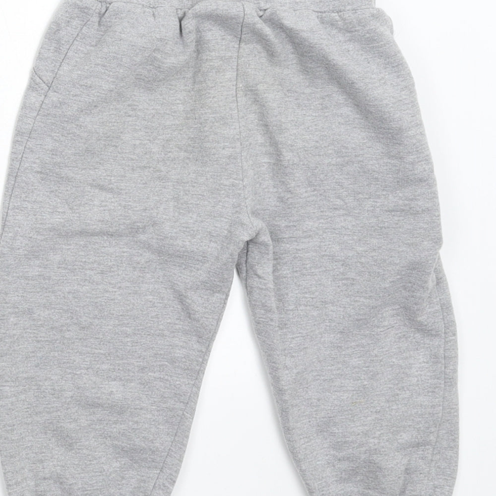 Brand and care label for Disney Baby Baby Grey sweatpants, size 18, Months