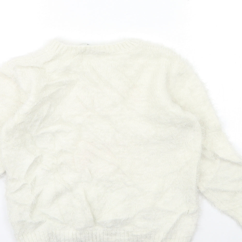 Brand and care label for EVIE girls’ white knit jumper, size 11, years