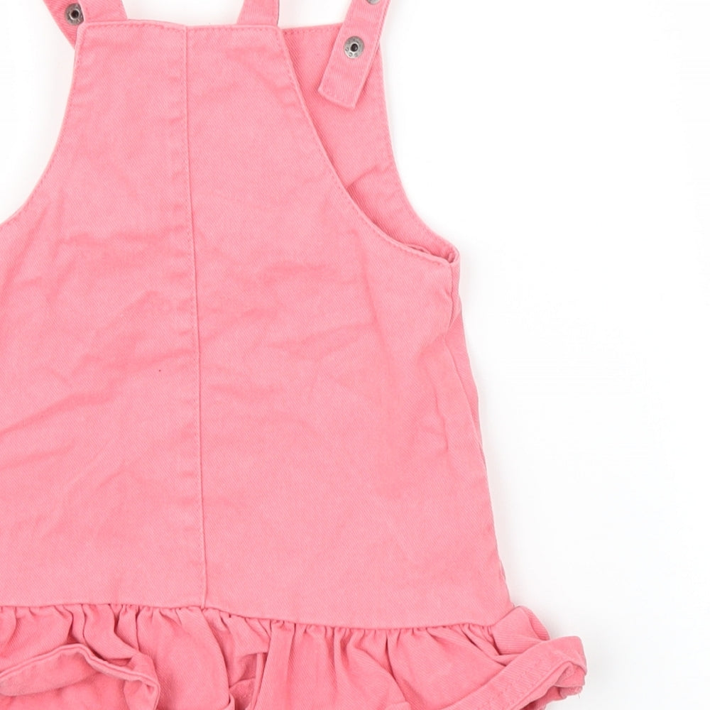 Brand and care label for F&F girls’ pink denim a-line, size 9-12, months