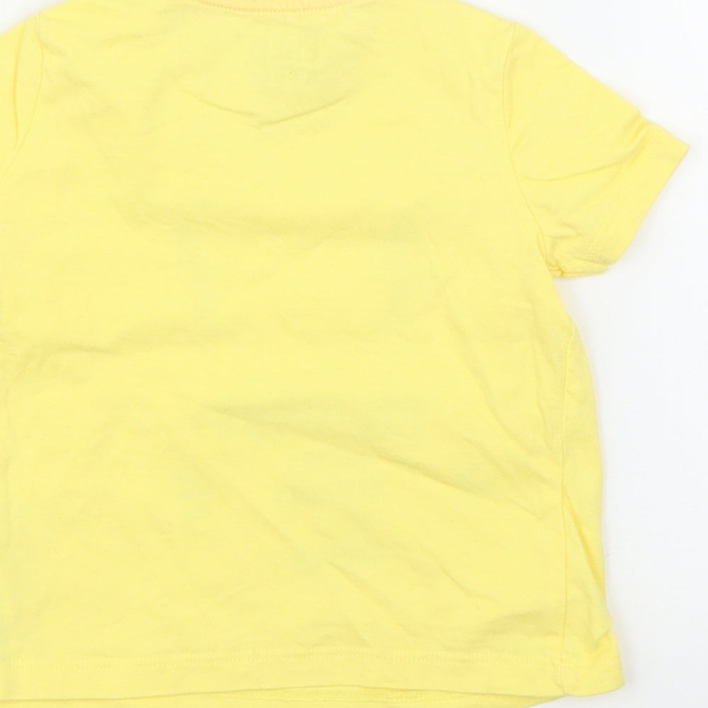 Brand and care label for F&F girls’ yellow basic t-shirt, size 6-9, months