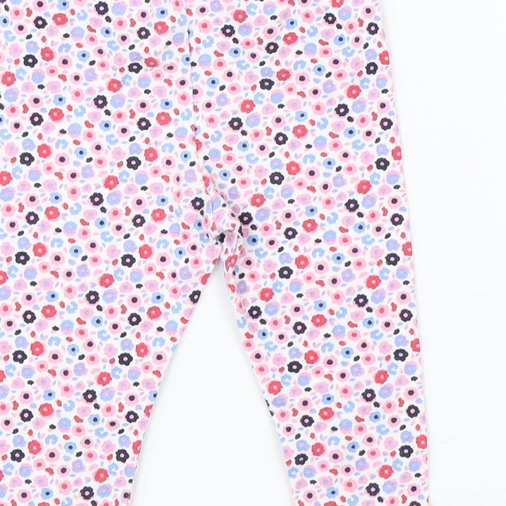 Brand and care label for George girls’ pink floral pyjama pants, size 6-9, months