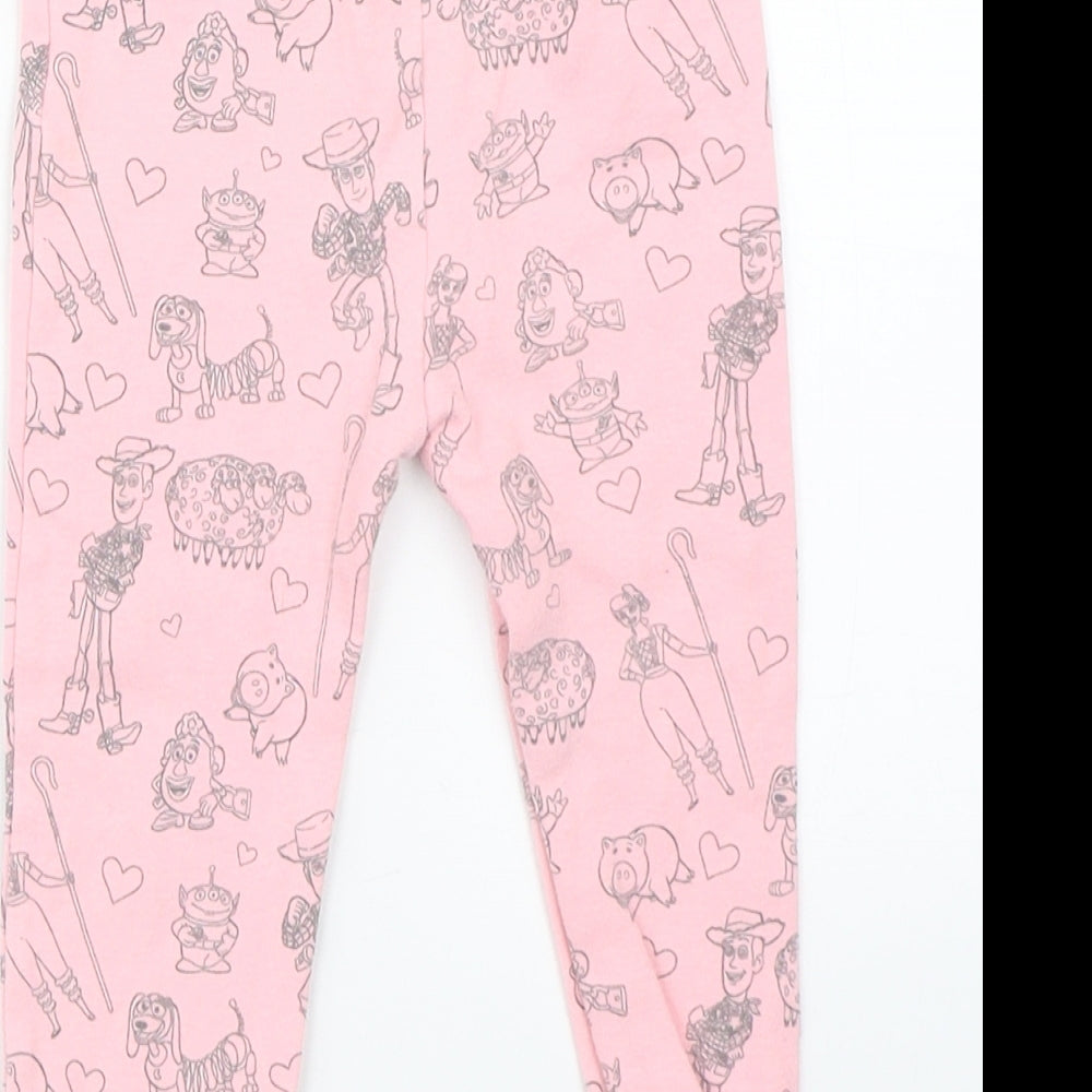 Brand and care label for Toy Story girls’ pink pyjama pants, size 12-18, months - disney toy story