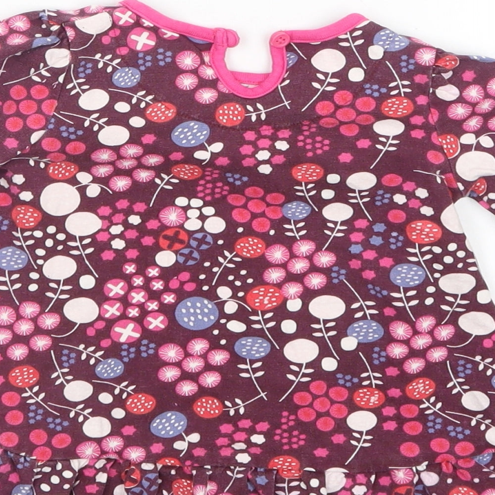 Brand and care label for Mini Club girls’ purple geometric t-shirt dress, size 6-9, months