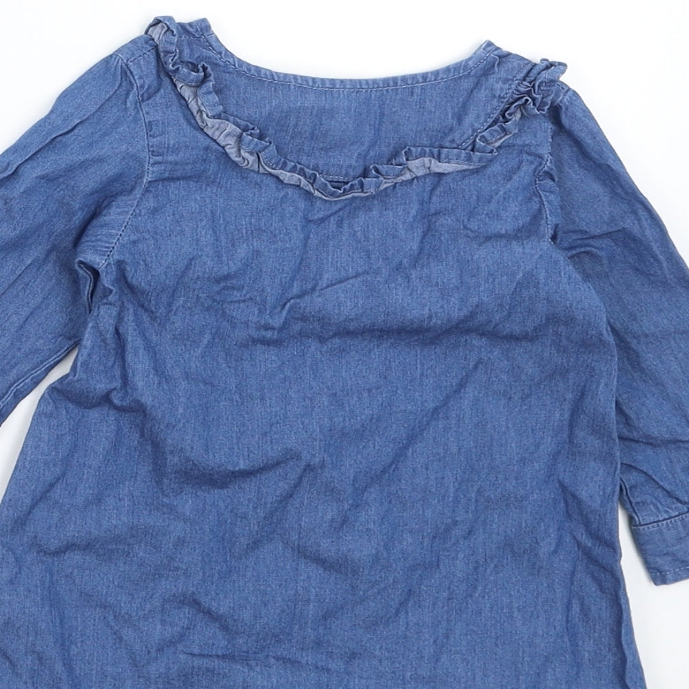 Brand and care label for Primark girls’ blue denim shirt dress, size 6-9, months