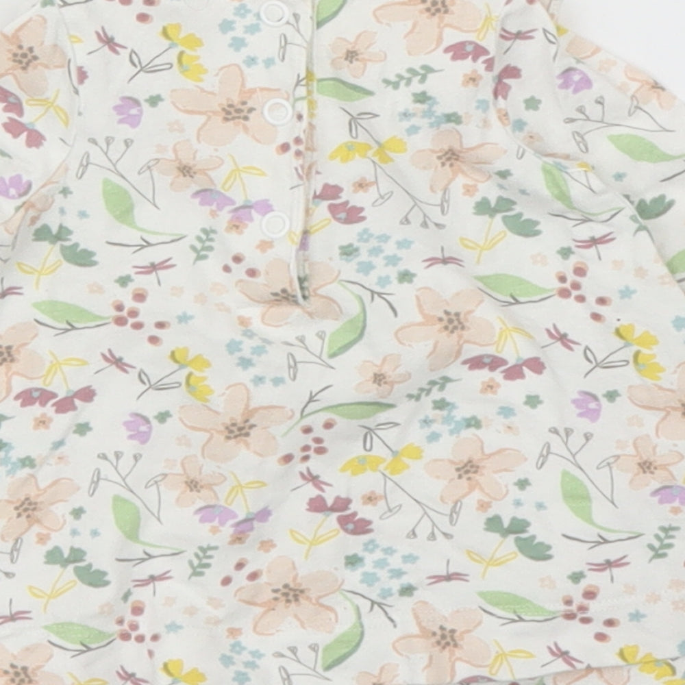 Brand and care label for Mini Club girls’ beige floral basic blouse, size 0-3, months