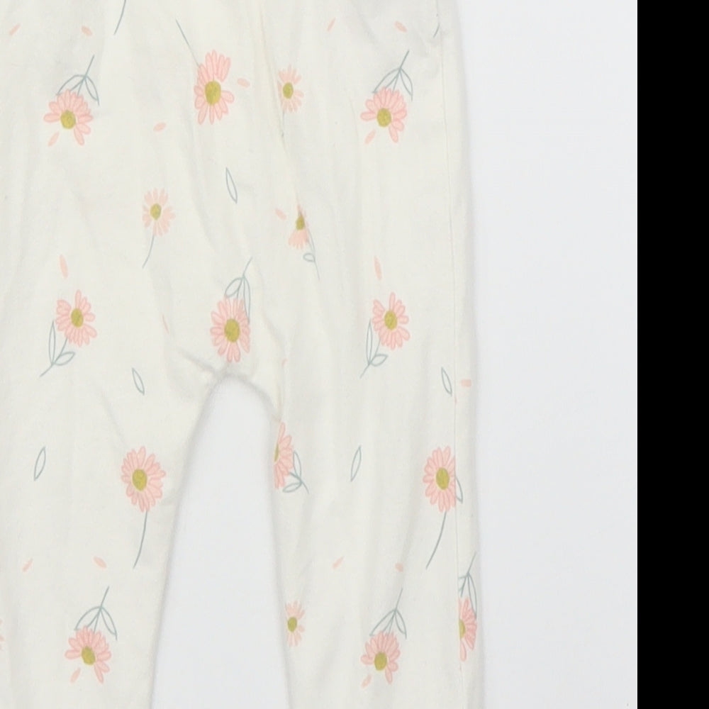 Brand and care label for George girls’ beige floral capri leggings, size 3-6, months