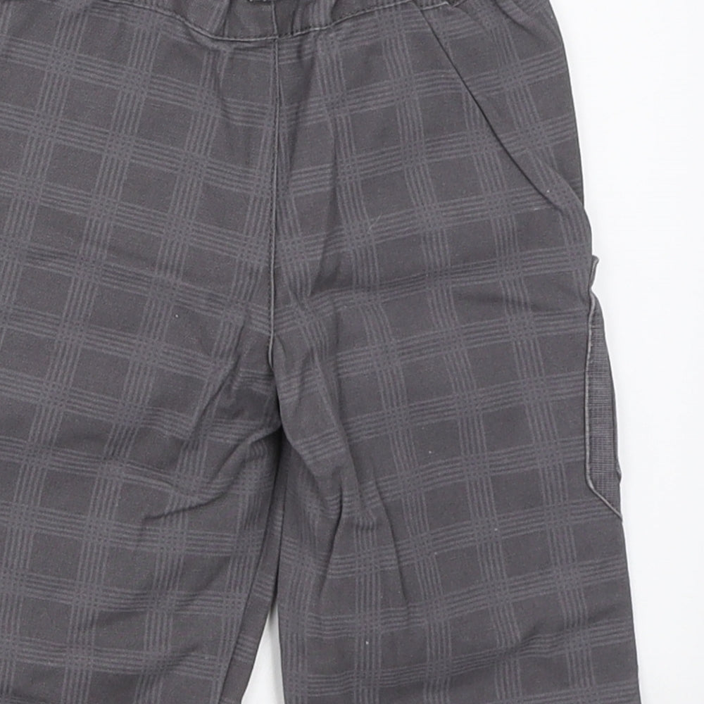 Brand and care label for Orchestra boys’ grey cropped trousers, size 12, months