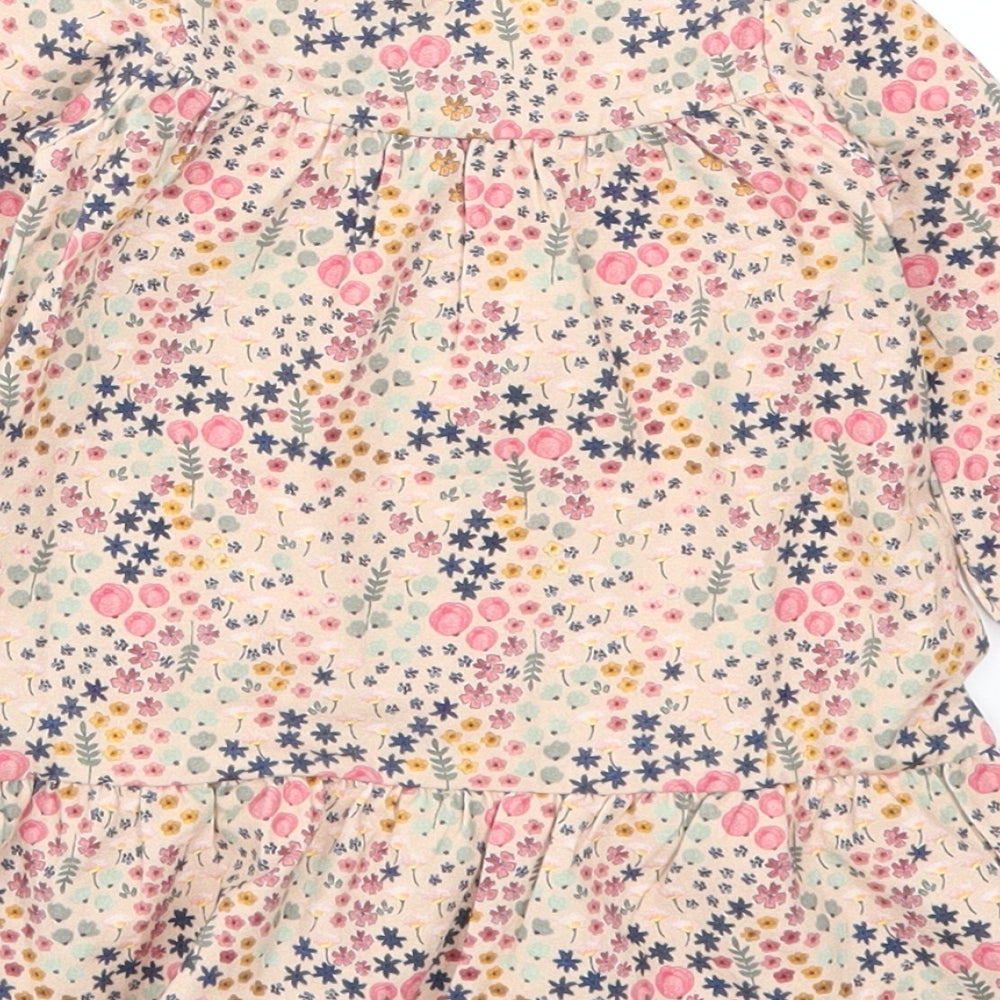 Brand and care label for Preworn girls’ pink floral trapeze & swing, size 3-6, months