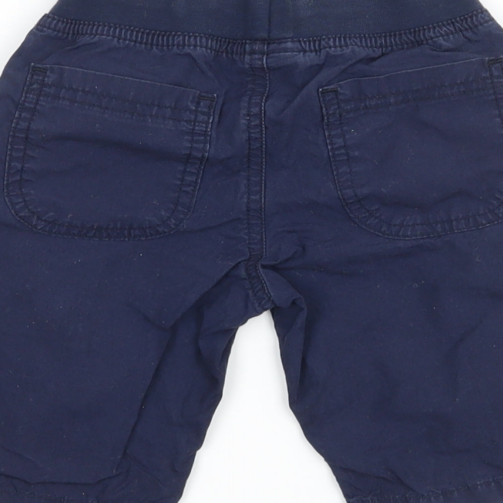 Brand and care label for JAKO-O boys’ blue ramie cargo trousers, size 12-18, months