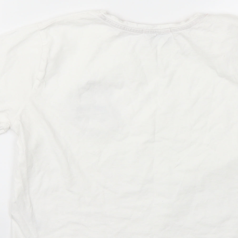Brand and care label for New Look girls’ white basic t-shirt, size S