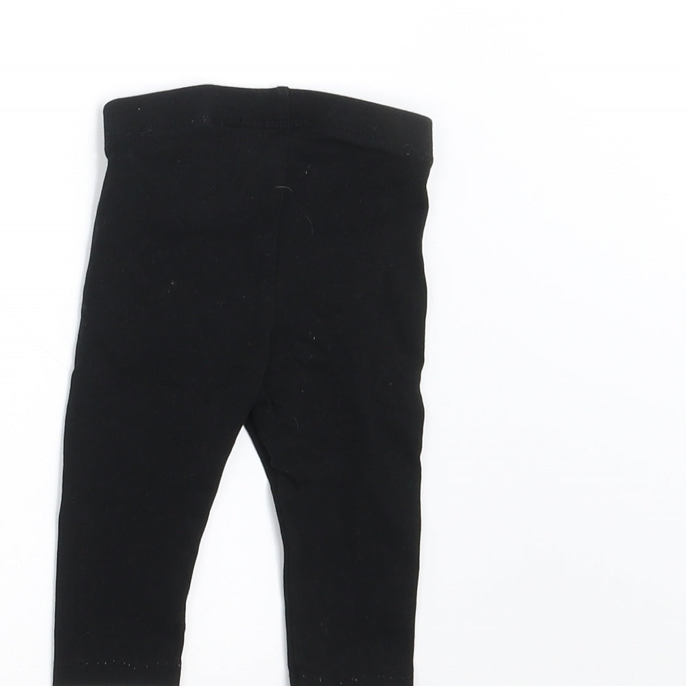Brand and care label for H&M girls’ black trousers, size 3-6, months - 2-4 months
