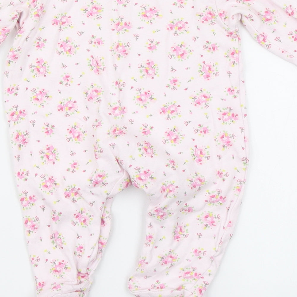 Brand and care label for Bebe Bonito girls’ pink floral babygrow one-piece, size 3-6, months