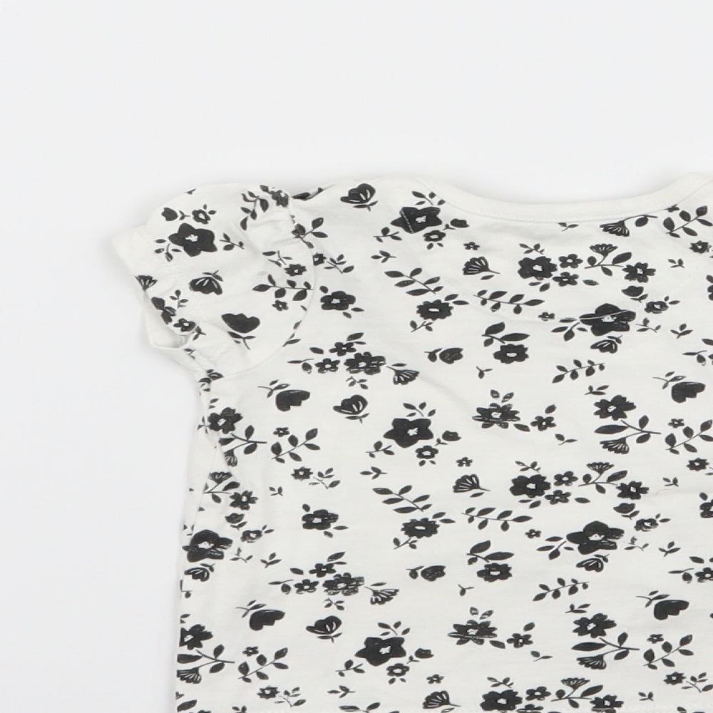 Brand and care label for nut, eg girls’ white floral basic t-shirt, size 3-6, months