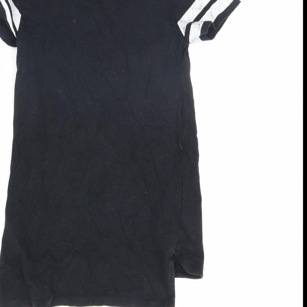 Brand and care label for Next girls’ black basic t-shirt, size 6, years