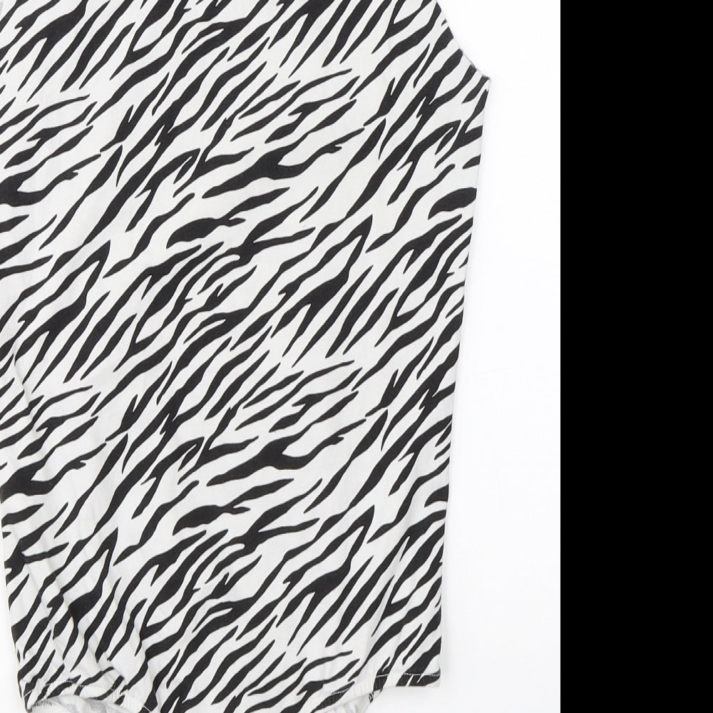 Brand and care label for ASOS women’s white animal print romper one-piece, size UK 10