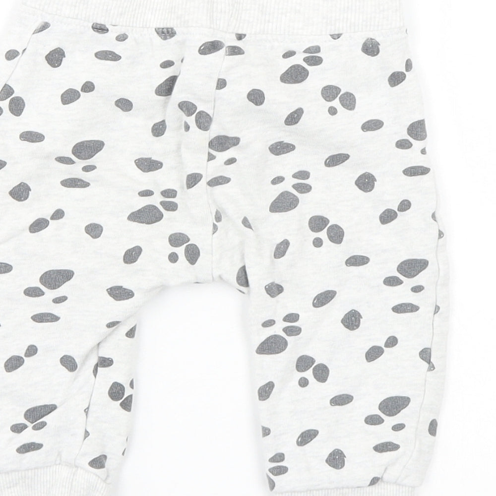 Brand and care label for Disney boys’ grey animal print sweatpants, size 6-9, months - disney
