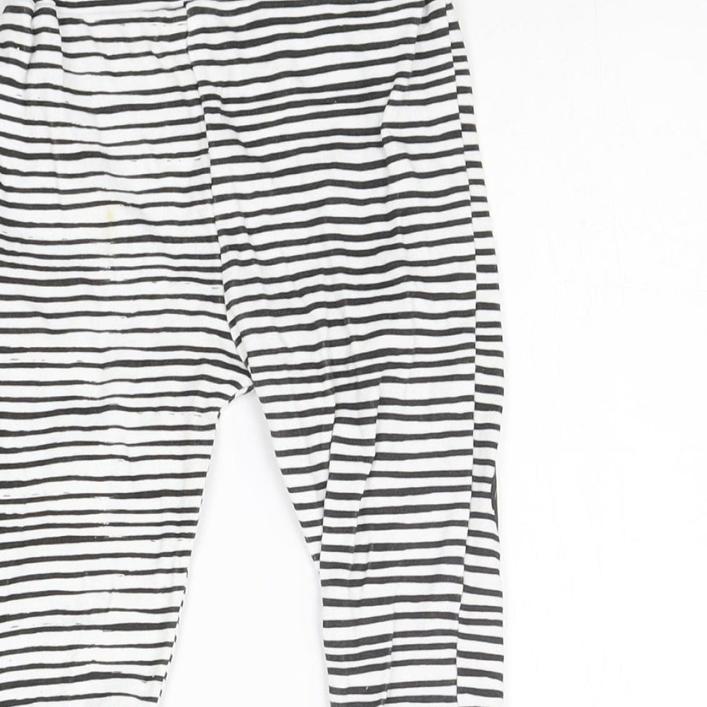 Brand and care label for Primark girls’ white striped jogger leggings, size 6-9, months - tiger king