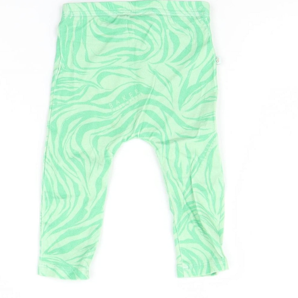 Brand and care label for Baker girls’ green animal print capri leggings, size 6-9, months