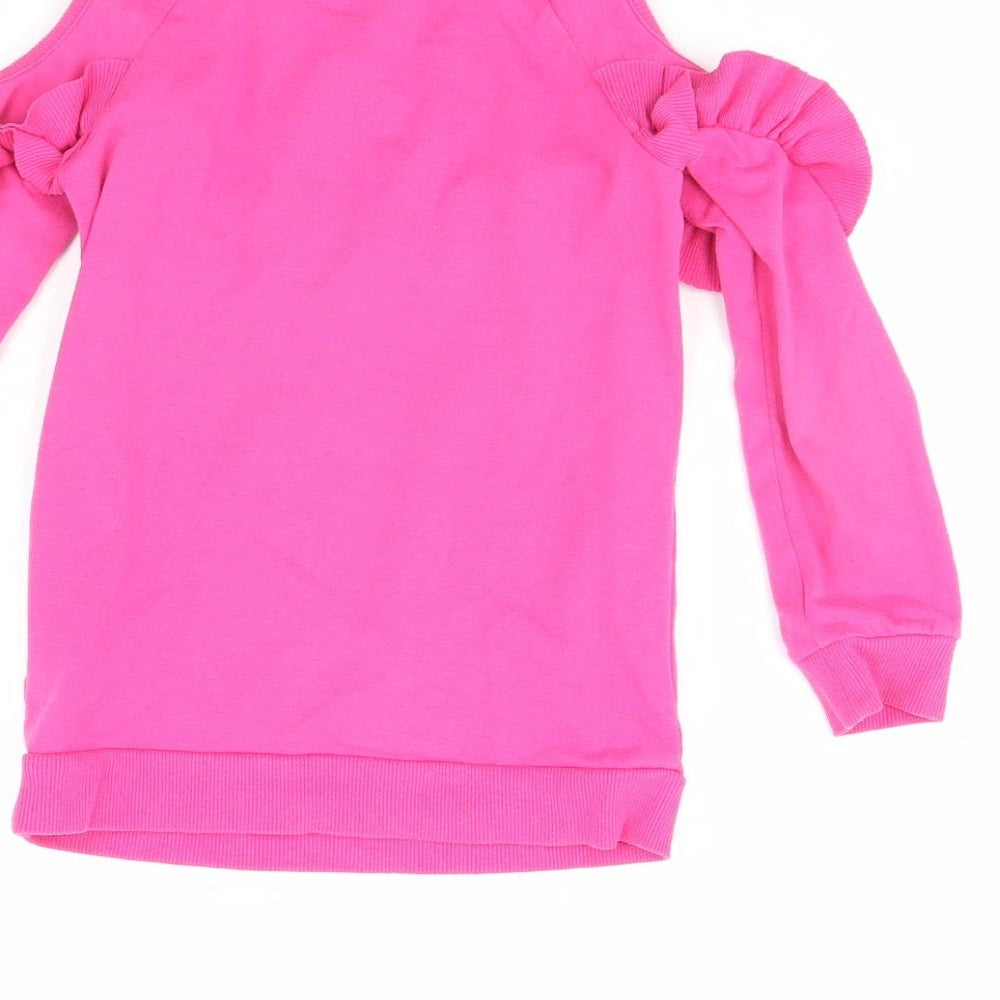 Brand and care label for Juicy Couture girls’ pink jumper, size 4, years