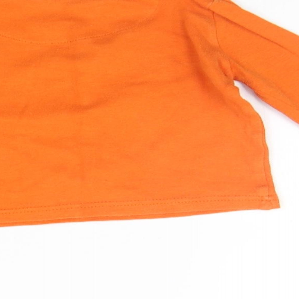 Brand and care label for Mothercare boys’ orange jumper, size 12-18, months