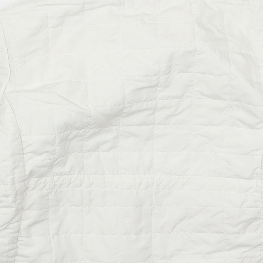 Brand and care label for Nucleo girls’ white quilted coat, size 6, years