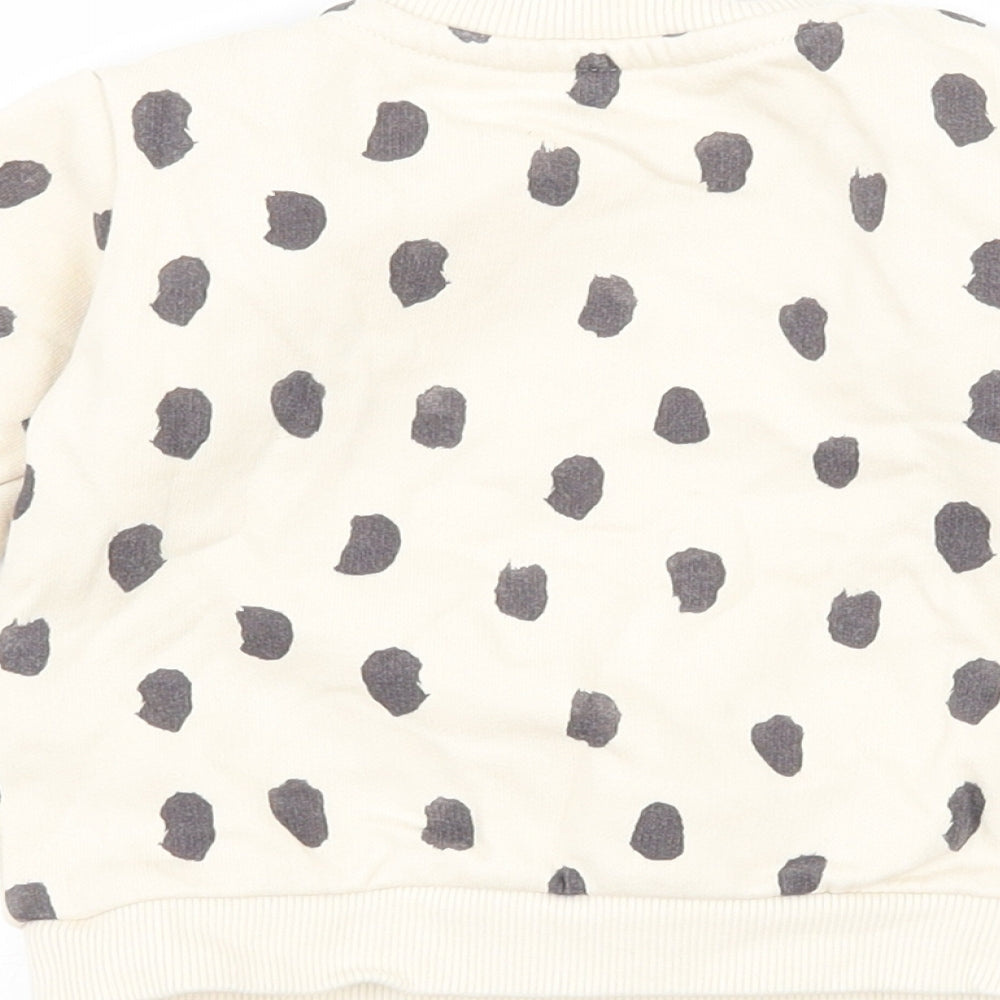 Brand and care label for &S Baby Beige Polka Dot Jersey jumper, size 3-6, Months