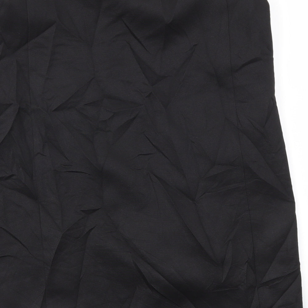 Brand and care label for Missguided women’s black jacket blazer, size UK 10
