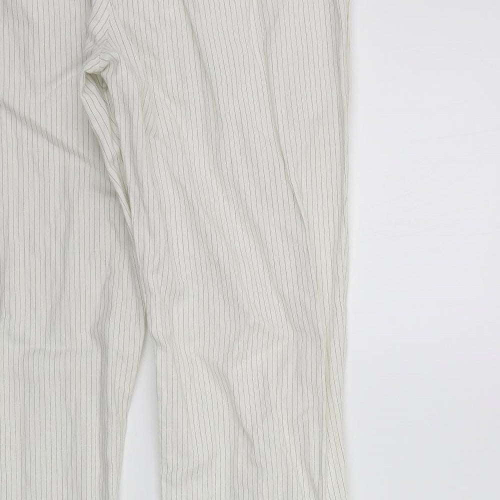Brand and care label for Denim & Co. women’s white striped trousers, size UK 33, in, 29-inch leg