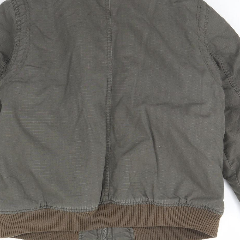 Brand and care label for Cherokee boys’ green jacket, size 11-12, years