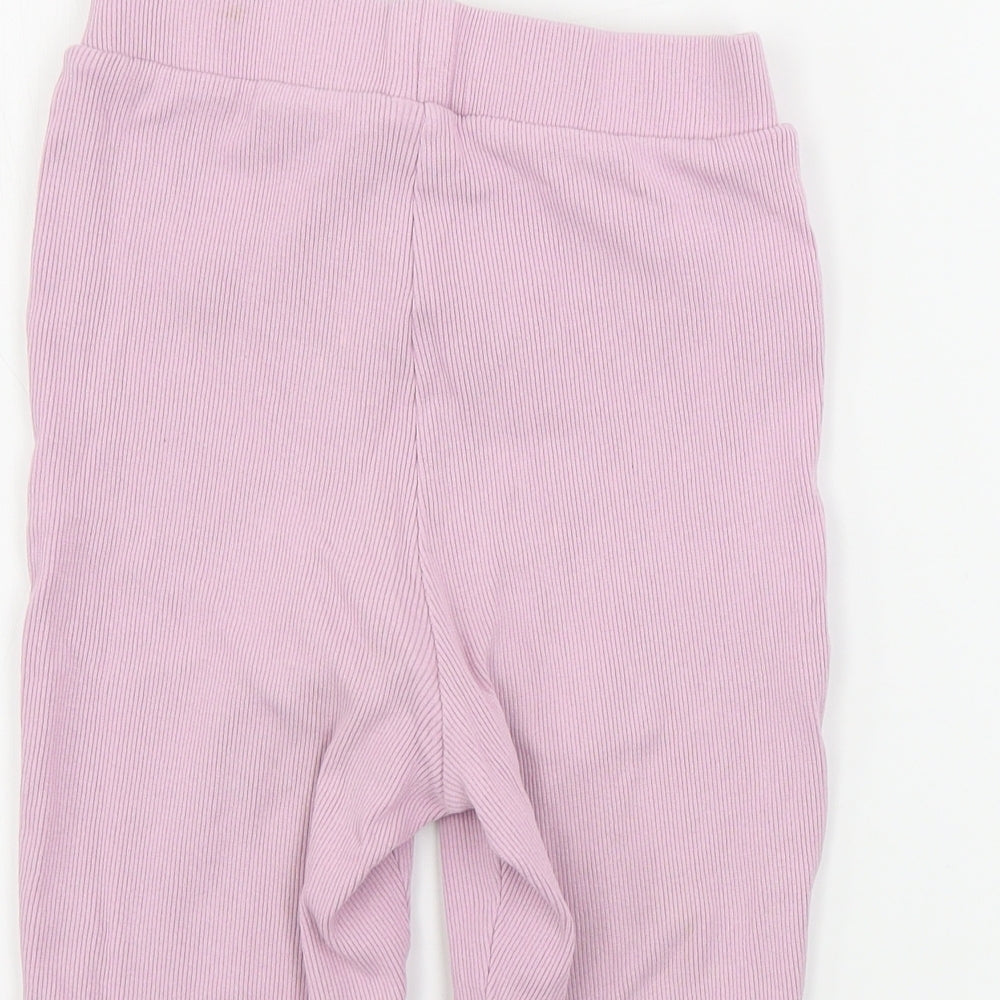 Brand and care label for ASOS women’s pink sweat shorts, size UK 6