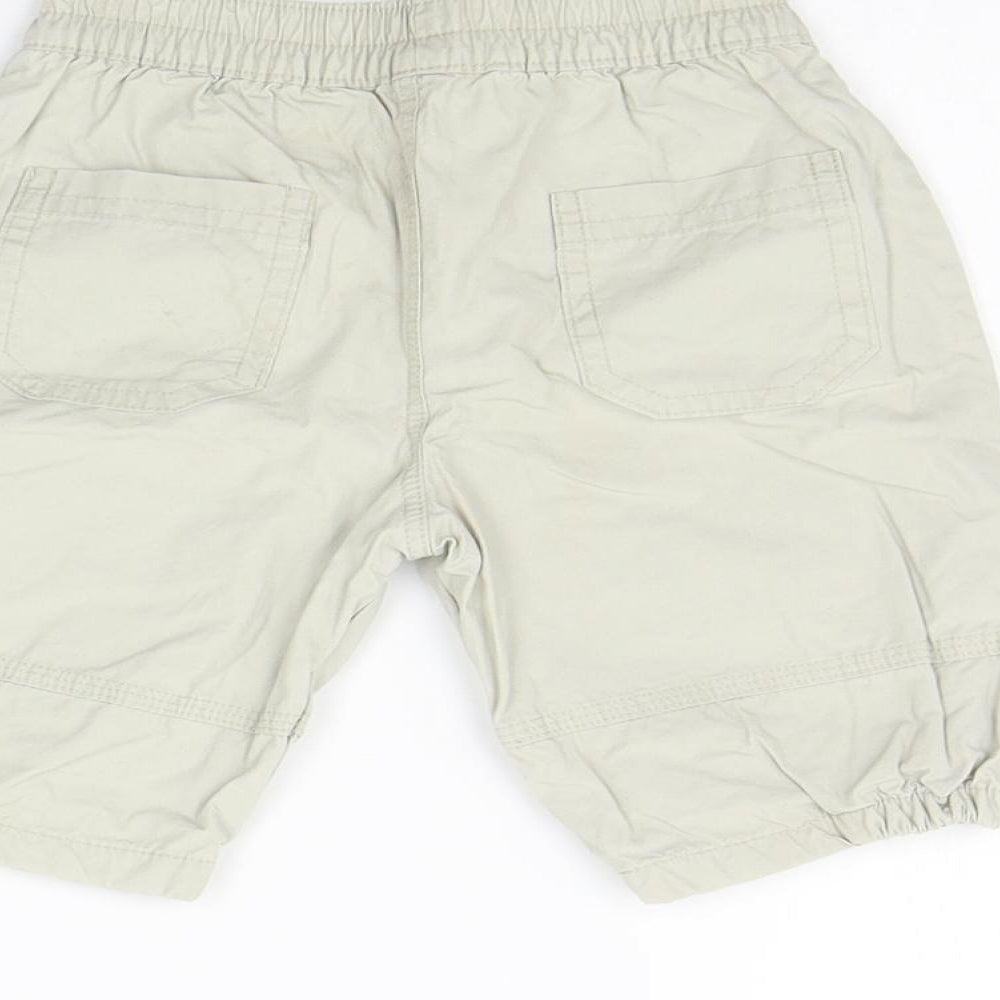 Brand and care label for Mothercare girls’ beige cargo trousers, size 0-3, months