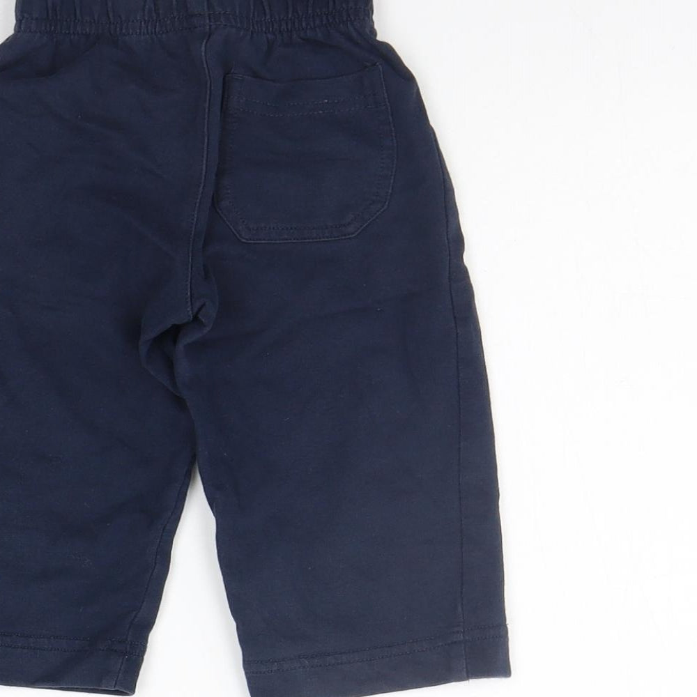 Brand and care label for George girls’ blue sweatpants, size 6-9, months - elastic waist band