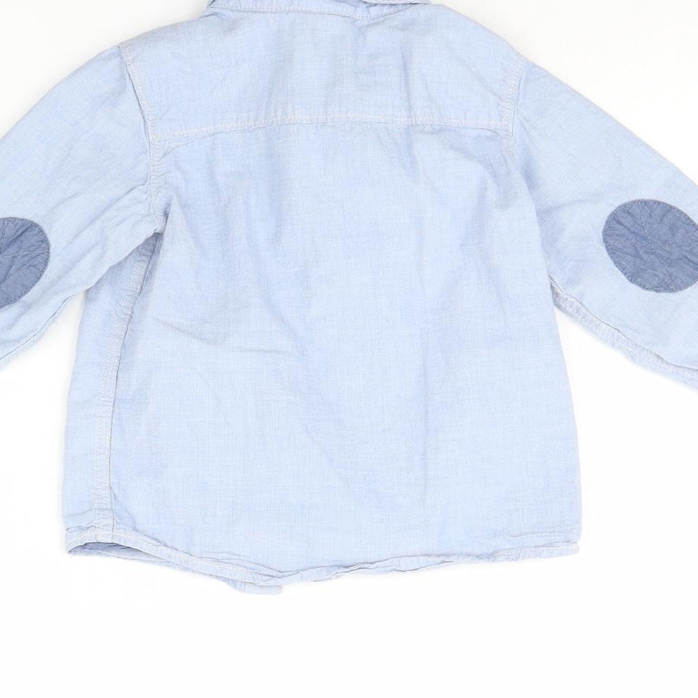 Brand and care label for H&M boys’ blue basic button-up, size 12, months