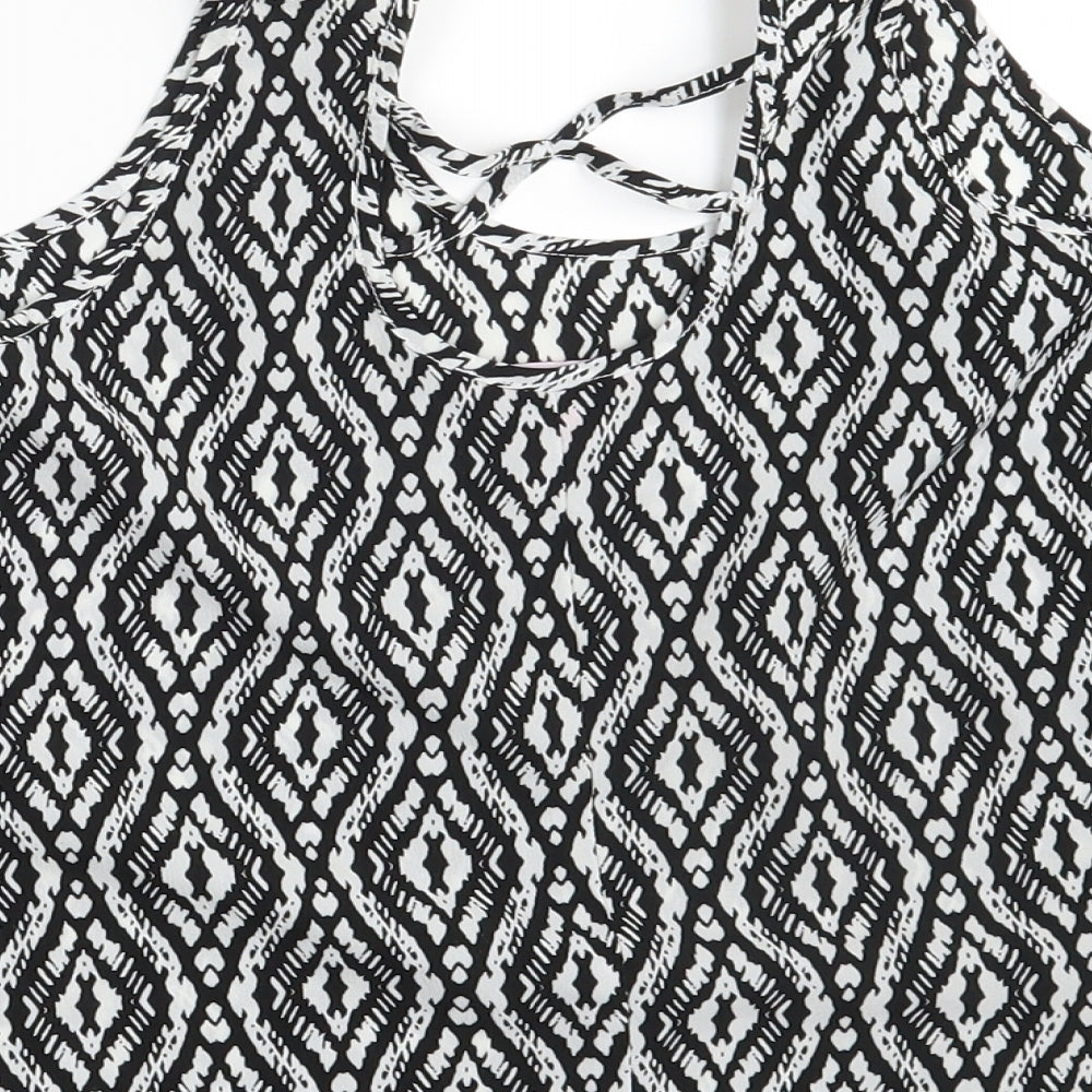 Brand and care label for YD girls’ black argyle/diamond basic blouse, size 11-12, years
