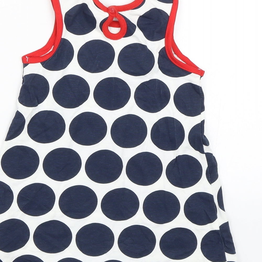 Brand and care label for George girls’ blue polka dot tank dress, size 9-12, months