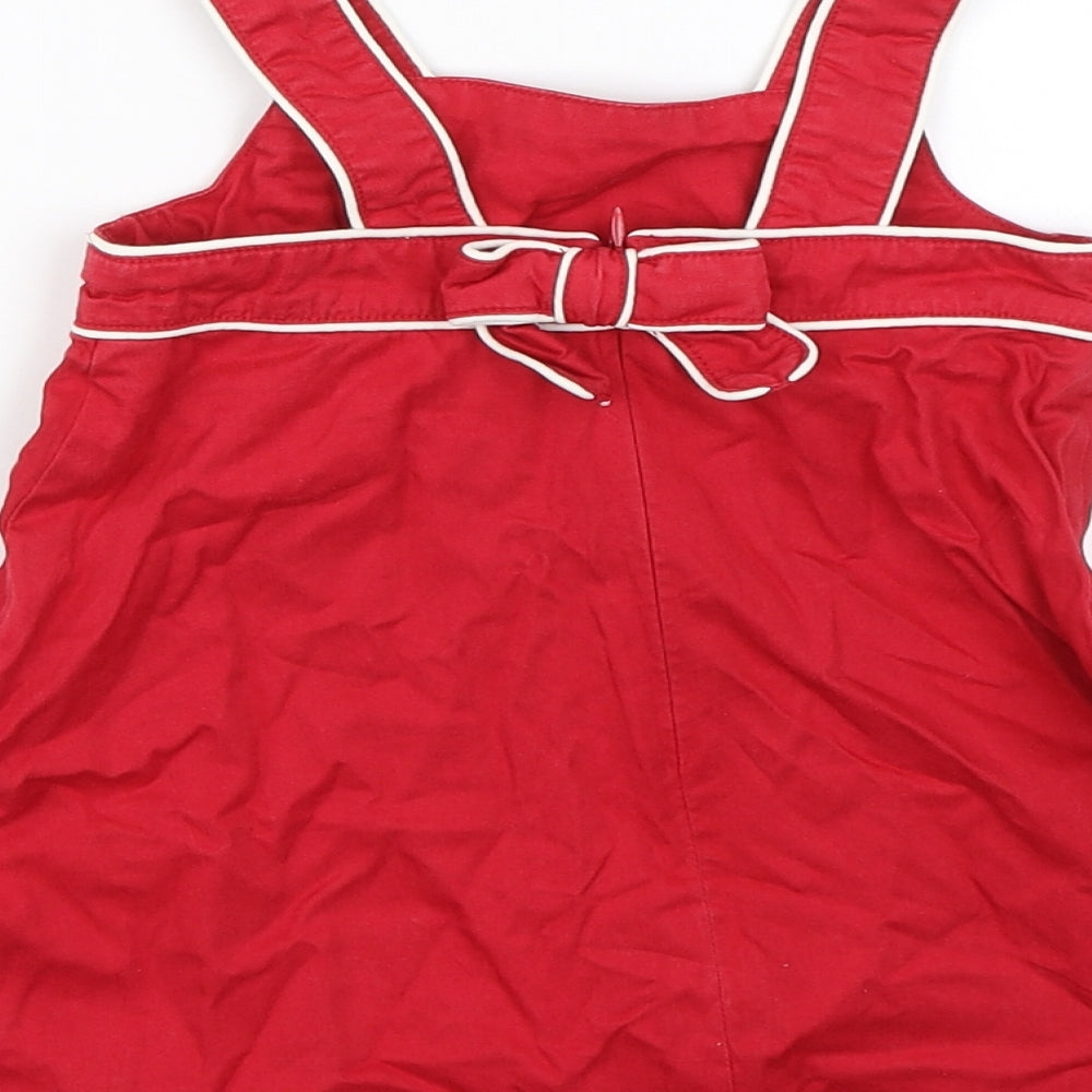 Brand and care label for Topalina girls’ red tank dress, size 12, months