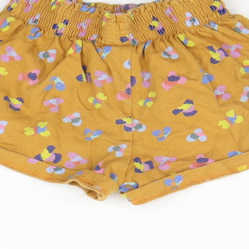 Brand and care label for Next girls’ yellow geometric cropped trousers - elastic waist band