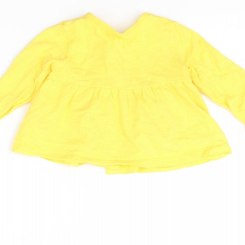 Brand and care label for Mothercare girls’ yellow jacket, size 3-6, months