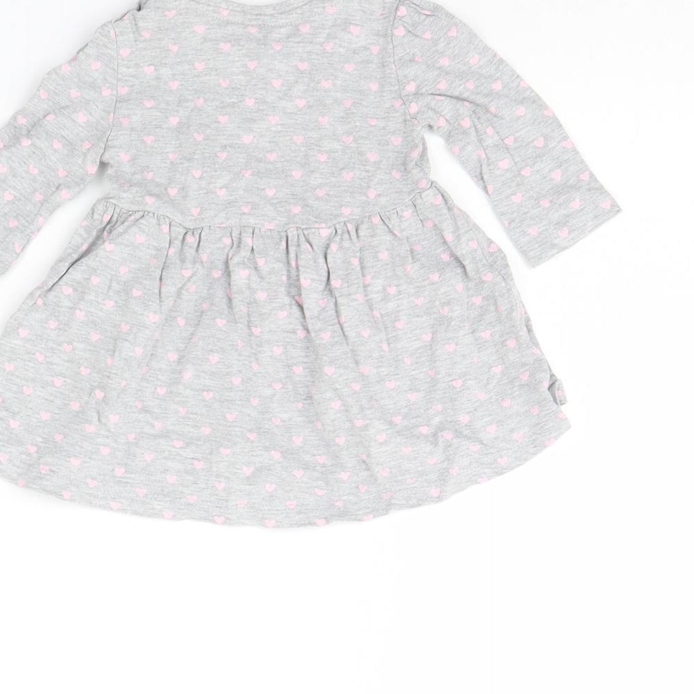 Brand and care label for Early Days girls’ grey spotted basic blouse, size 0-3, months