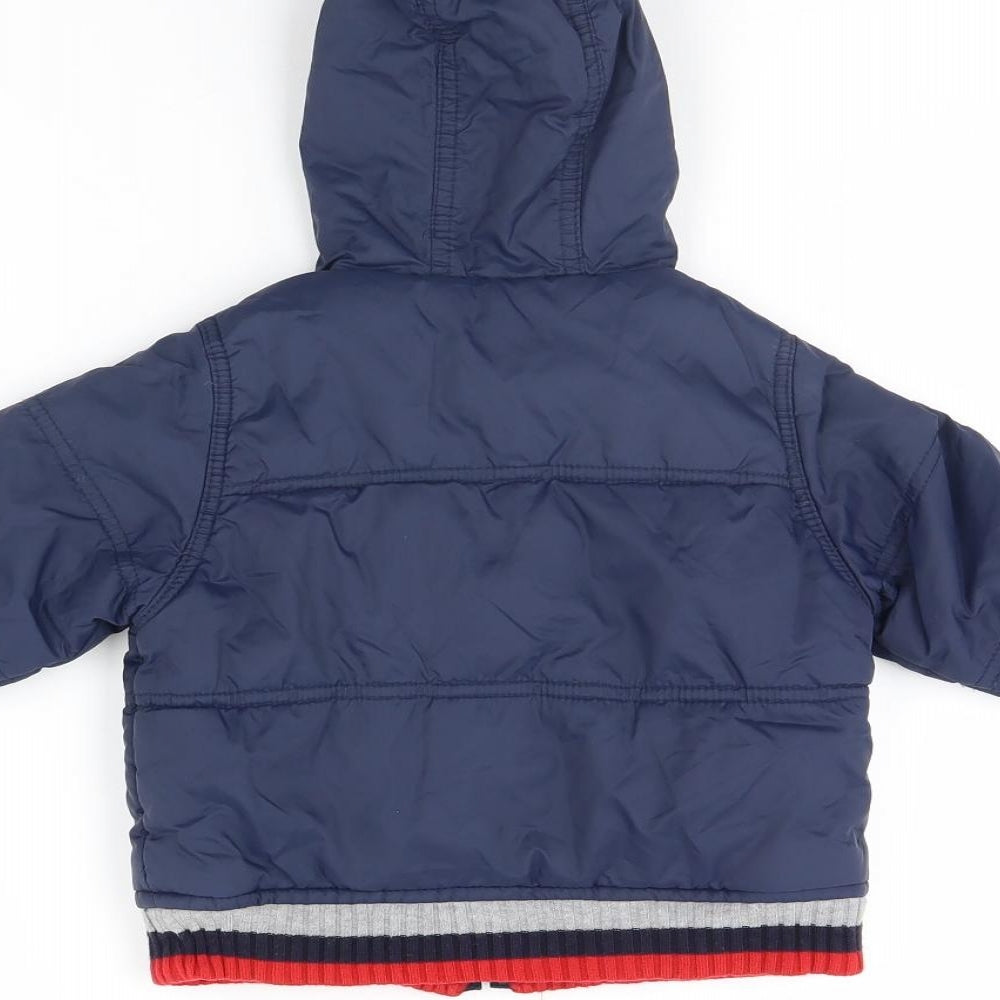 Brand and care label for Mini Mode boys’ blue jacket, size 6-9, months