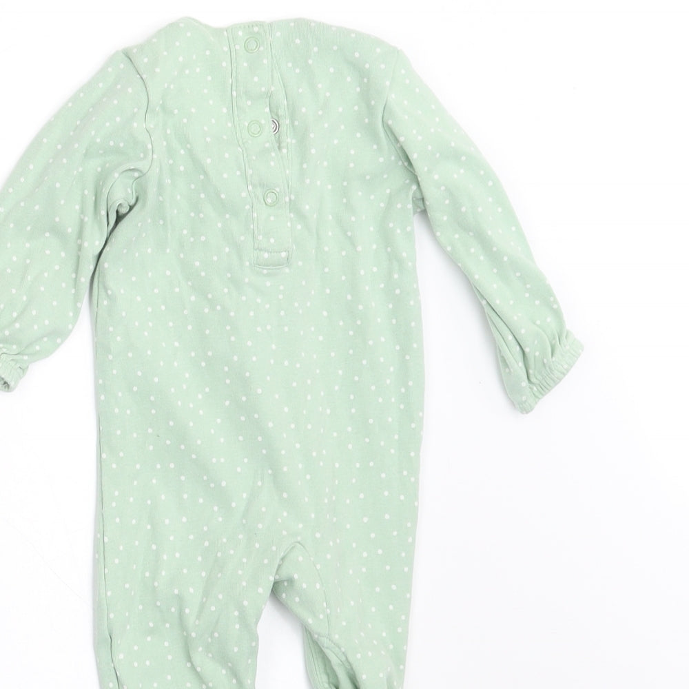 Brand and care label for Marks & Spencer girls’ green polka dot babygrow one-piece, size 3-6, months - frilled front
