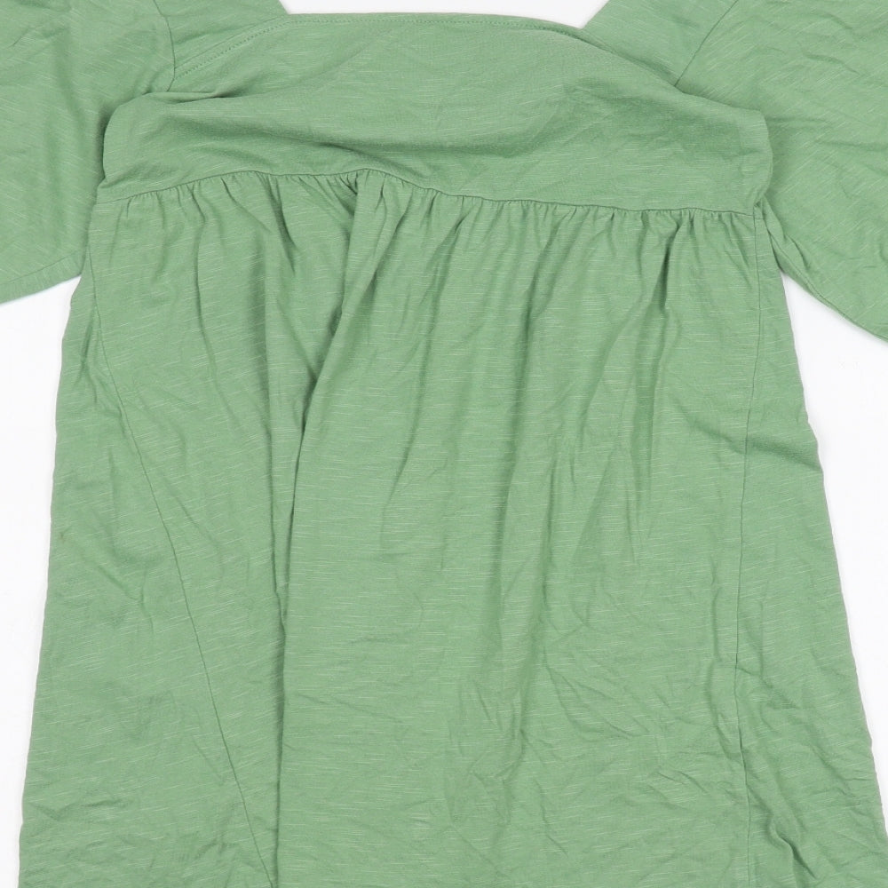 Brand and care label for ASOS women’s green basic t-shirt, size UK 8