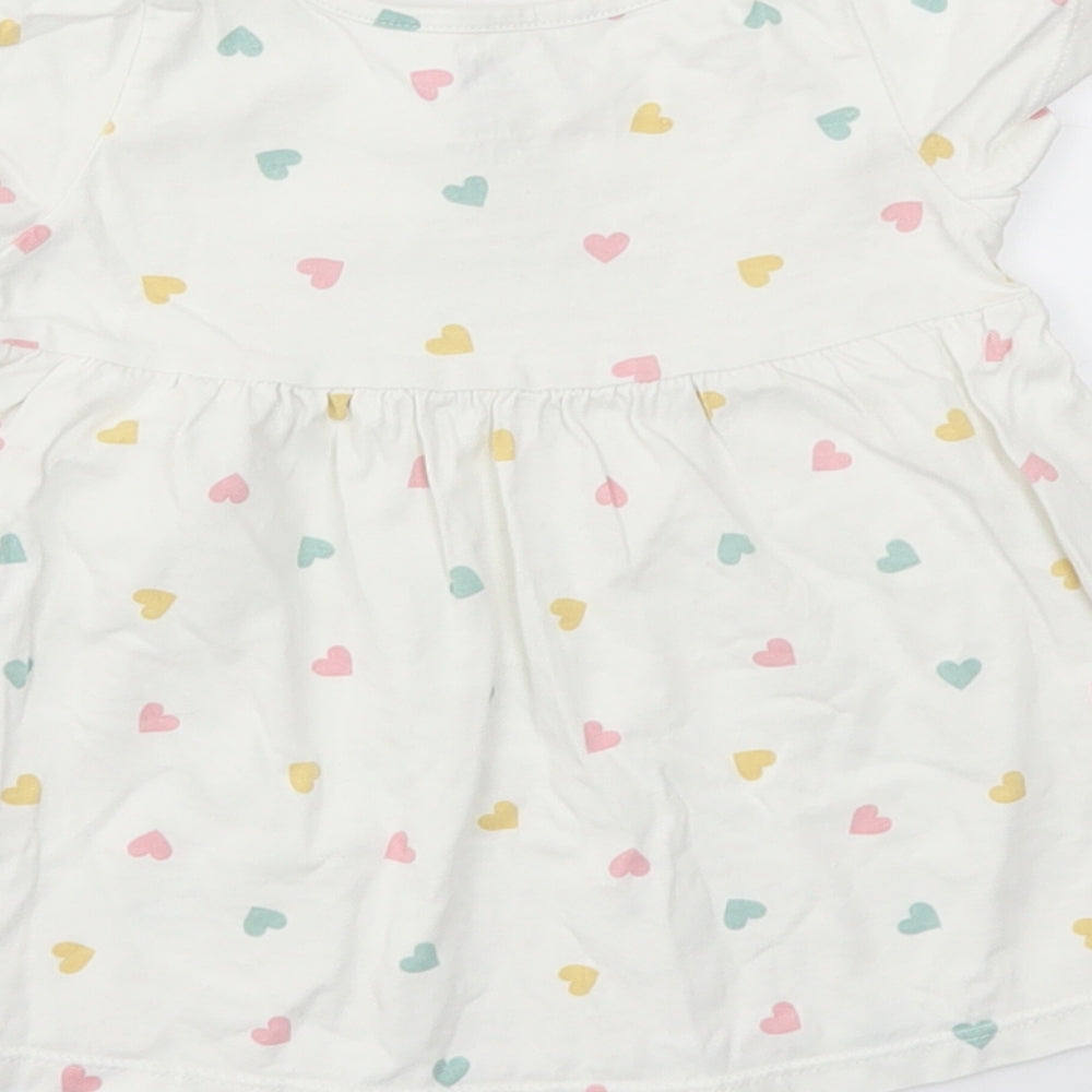 Brand and care label for H&M girls’ multicoloured geometric basic t-shirt, size 3-6, months