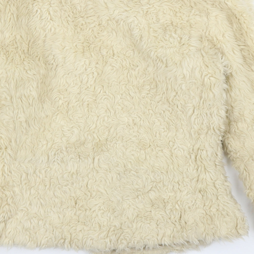 Brand and care label for New Look girls’ ivory overcoat coatigan, size 14, years