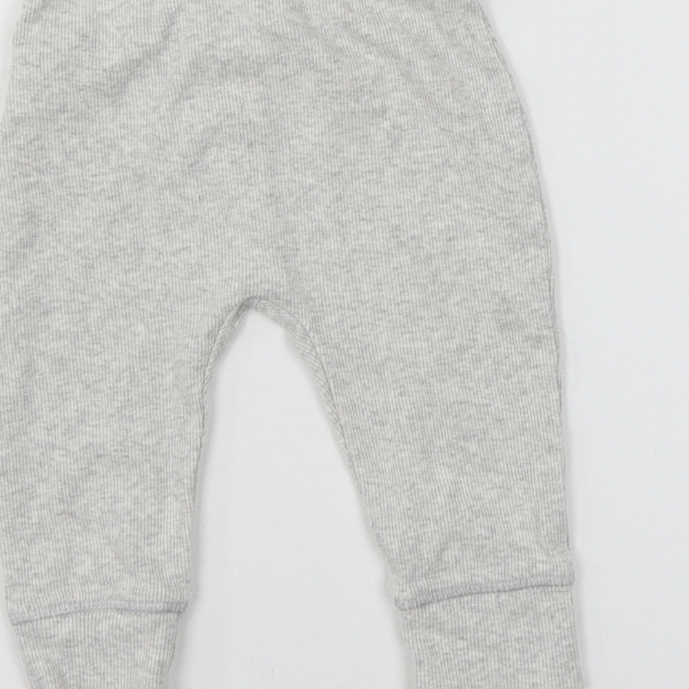 Brand and care label for Marks & Spencer girls’ grey jersey jogger trousers, size 6-9, months