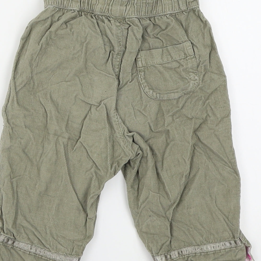 Brand and care label for H&S girls’ green colourblock jogger trousers, size 6-9, months
