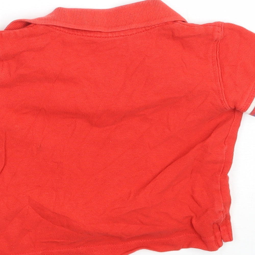 Brand and care label for Mothercare boys’ red basic polo, size 6-9, months