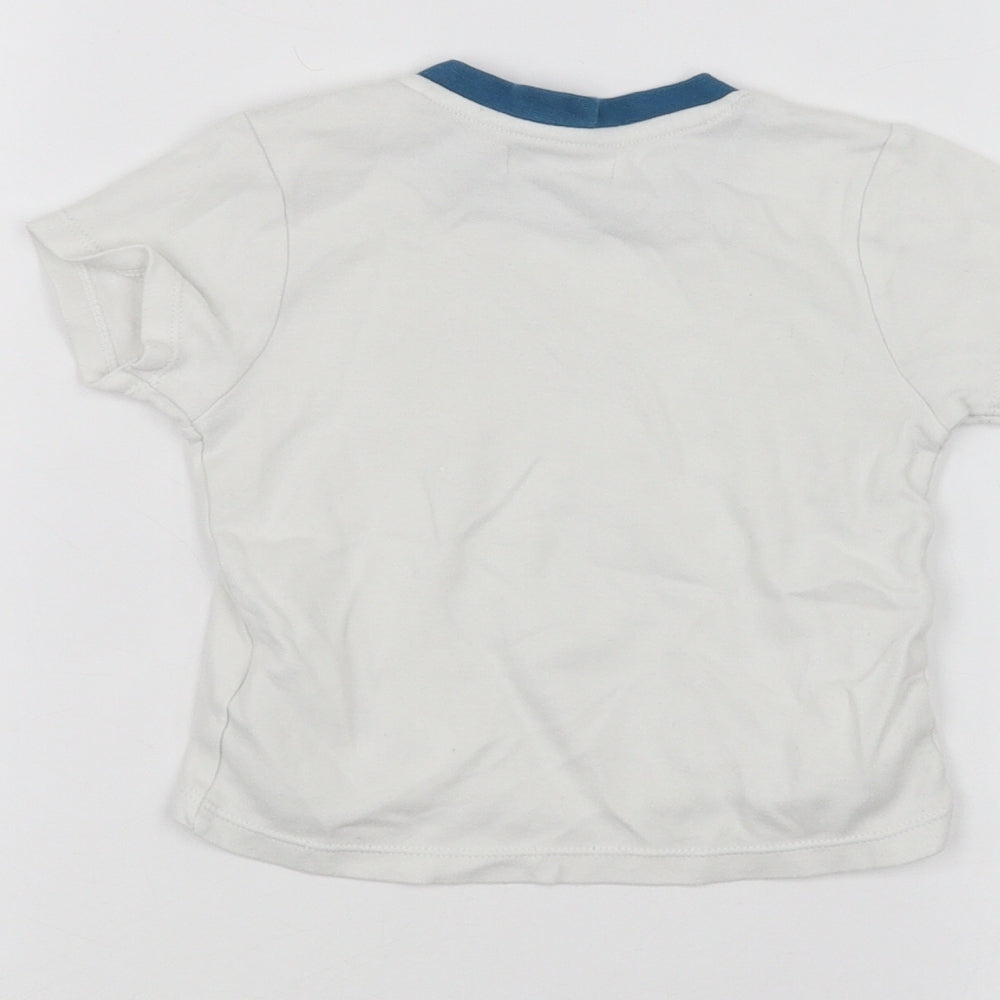 Brand and care label for Ladybird Baby White Basic T-Shirt, size 12-18, Months