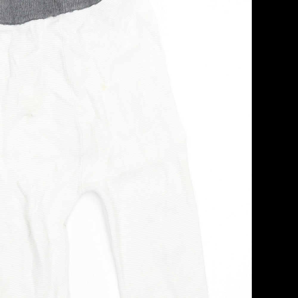 Brand and care label for Disney Baby Baby White Knit Capri Trousers, size 12-18, Months
