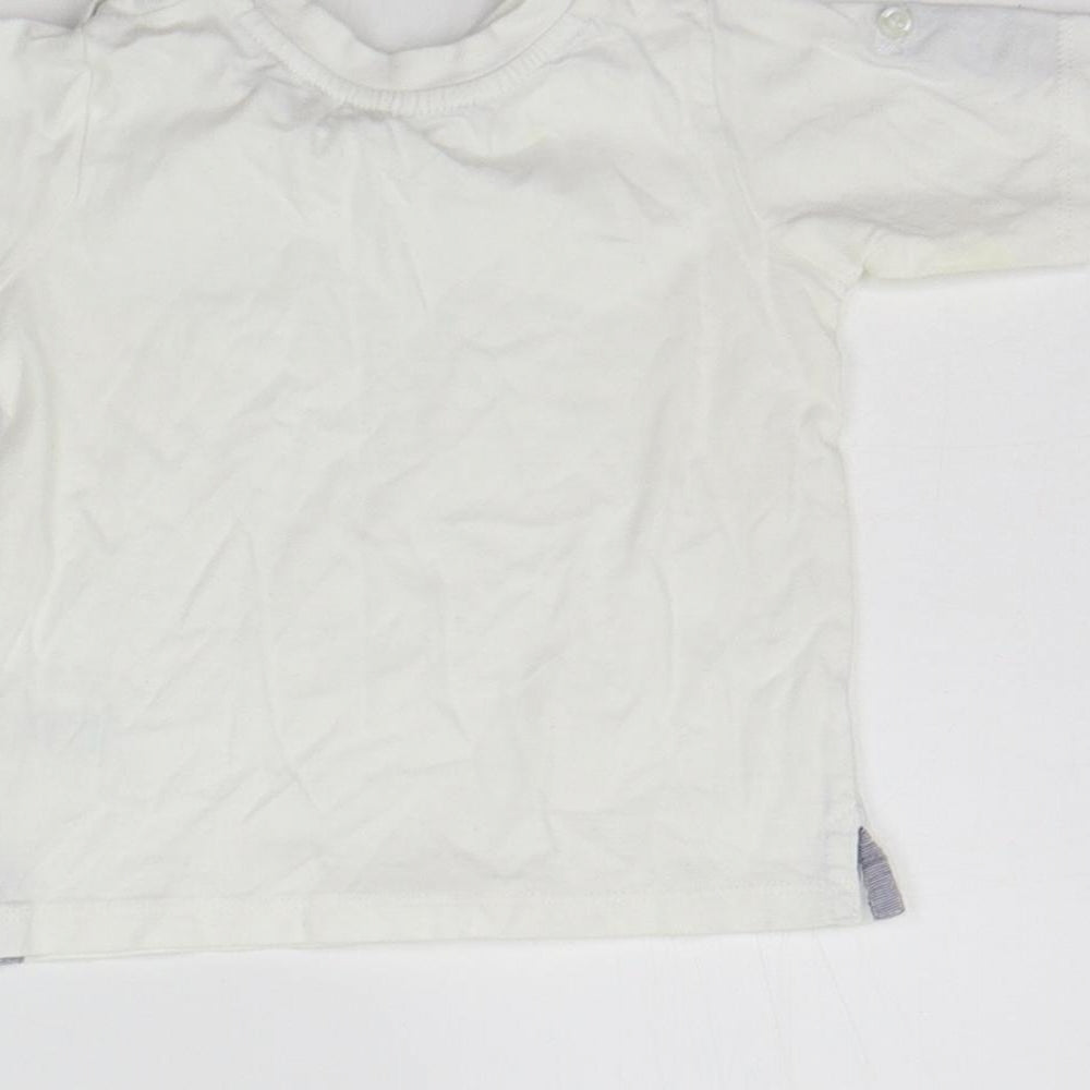 Brand and care label for Matalan girls’ white basic t-shirt, size 6-9, months